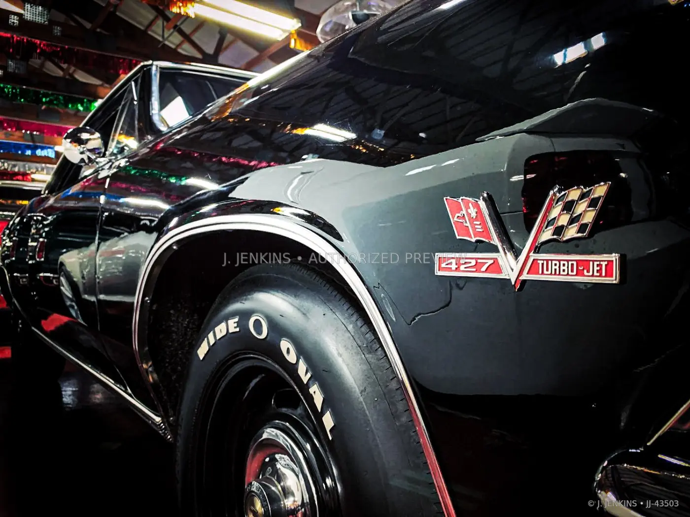 Close sculptural view of a black 427 muscle car