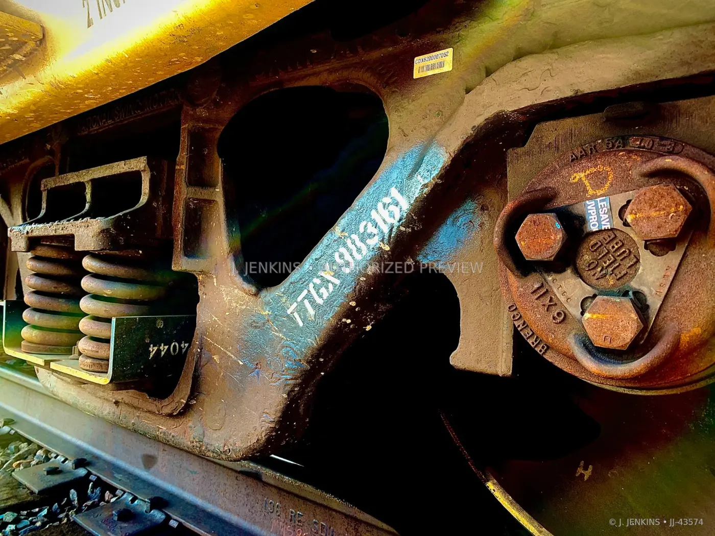 Close view of springs, bolts, and steel train hardware